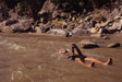 man with beer in river 